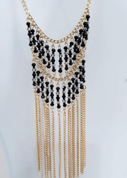 Conjunto Brinco E Colar Franja. DESCRIÇÃO DO PRODUTO:Marca: FEITO A MÃO BIJUTERIAS FINASMateriais: corrente de alumínio no banho dourado, cristal e miçangas de vidro. Acompanha brinco e extensor... 