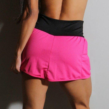 Short saia com bolsos em Dry Fit. Marca: Carioca FitComposição short de baixo: 90% Poliéster 10% Elastano Composição da Sainha: 100% Poliéster 